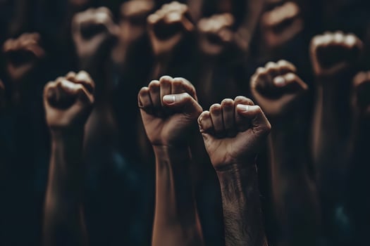 Hands raised in the air with a crowd of people photo