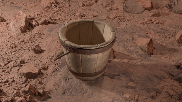 old wooden bucket on the dirt floor photo