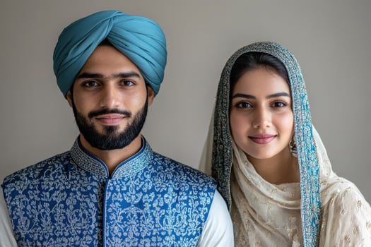 A young man and woman in traditional clothing. photo