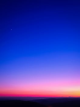 Beautiful sunset sky with blue and purple colors. Phone or desktop wallpaper photo