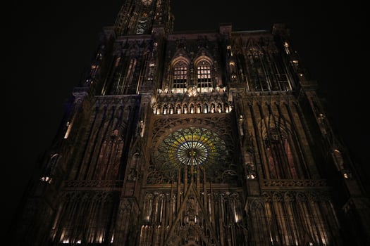 Strasbourg Cathedral facade and rose window at night photo
