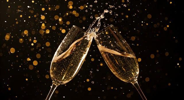 Celebrating special occasion with sparkling wine champagne glasses clinking photo