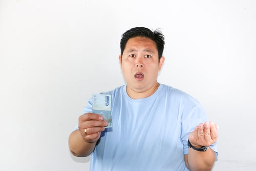 Asian man holding a banknote photo