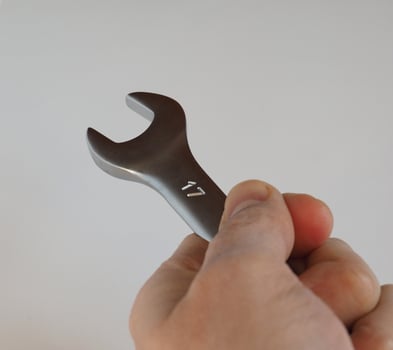 hand holds wrench spanner size 17 mm photo