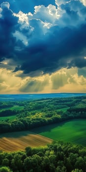 A beautiful view of a green field and clouds photo
