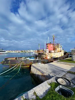 Atlantic Ocean, Bermuda 10. 22. 2023 Rusty Tugboat Docked. Morning Light photo