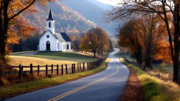 Winding country road leading to white church in autumn landscape photo