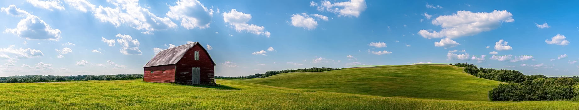 A red house sits on top of a hill photo
