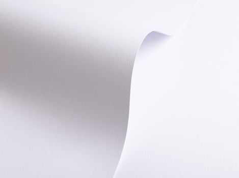 White paper background with a smooth texture and minimalistic design. A rich gradient effect with photo