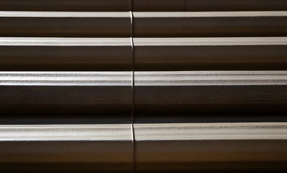 Each vertical strip has a unique texture, some appearing more corrugated photo