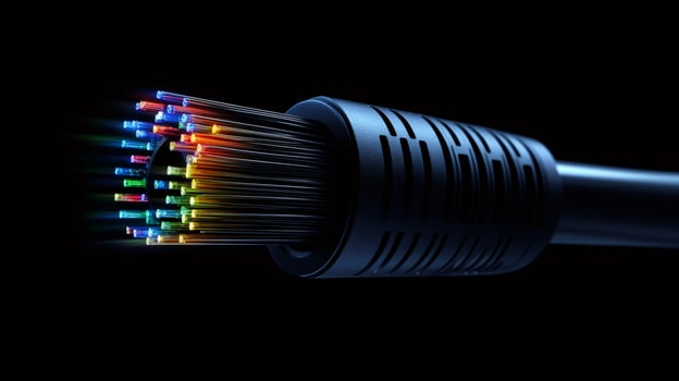 Fiber optic cable transmitting data with colorful light beams on black background photo