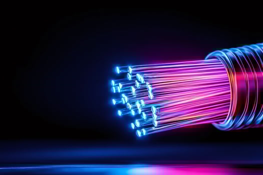 Fiber optic strands glowing with neon light, transmitting data at high speed photo