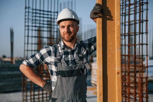 Confident worker. Man is on the construction ,site at daytime photo