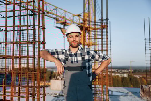 Front view of man that is working on the construction site at .daytime photo