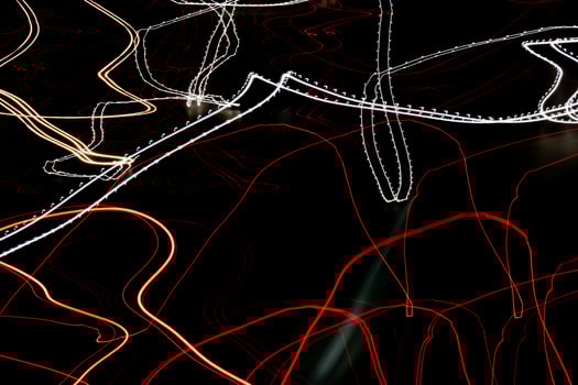 colored lines of lights on a black background photo