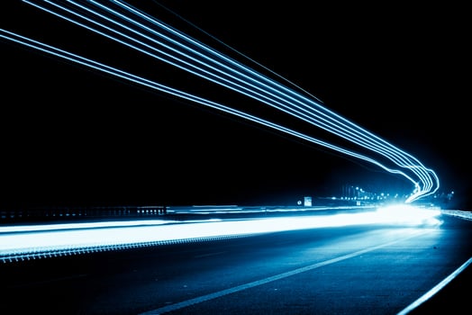 blue car lights at night. long exposure. light fast photo