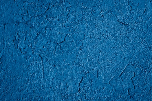 the wall is painted blue with visible details photo