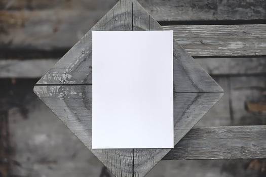 Blank White Paper Mockup on Rustic Wooden Table photo