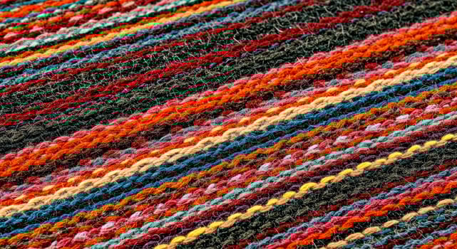 A close up of a colorful striped blanket photo