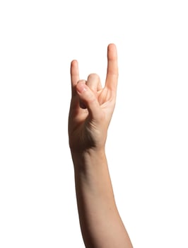 Hand making the rock horns gesture, symbolizing punk, metal, and music culture. Caucasian female photo