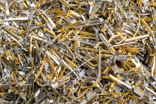 industrial gold waste from electronic components. background photo