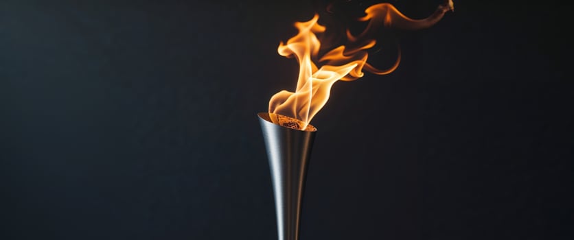 Beautiful torch with burning fire on black background. photo