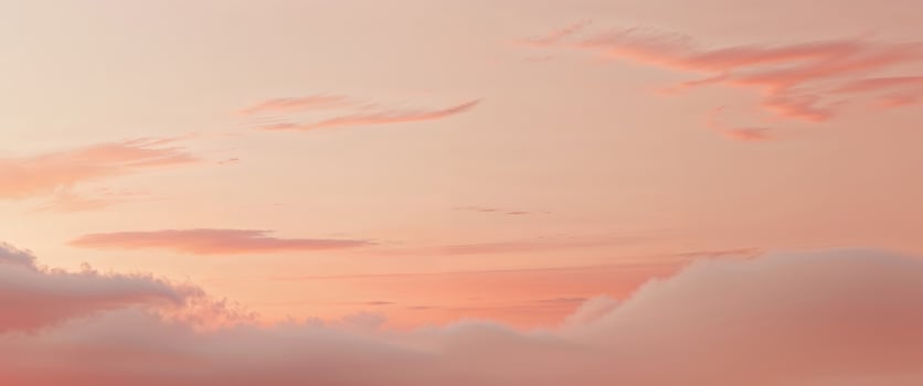 A sunset sky with clouds and a plane flying photo