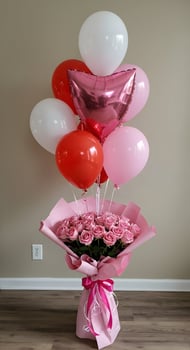 A bouquet of pink roses and balloons photo