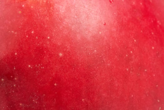 Red apple texture as background. Apple skin macro photo. photo