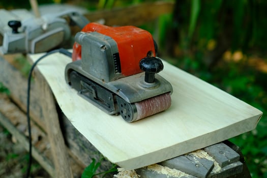 Sandpaper polisher on wood in vintage carpentry setting photo