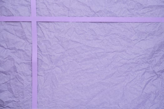 Crinkled violet paper with ribbon texture photo