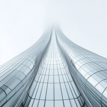 A tall building with glass windows and a sky background photo