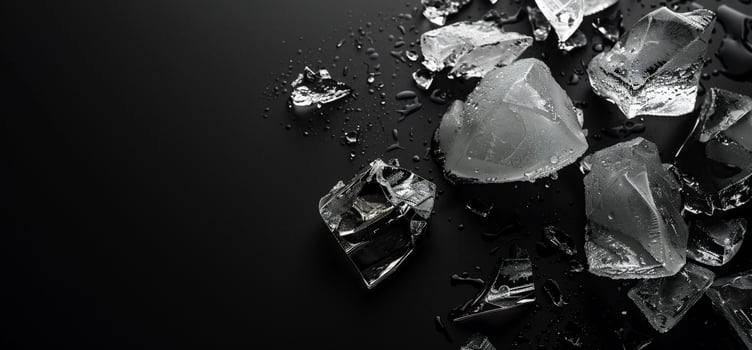 Broken Ice Cubes on Dark Surface photo