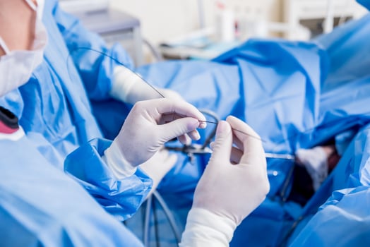Medical drip tubing and patient at the hospital. photo