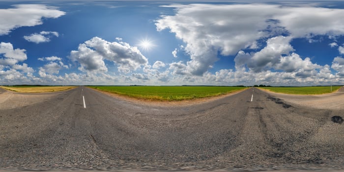 360 panorama of a road with clouds and sun photo