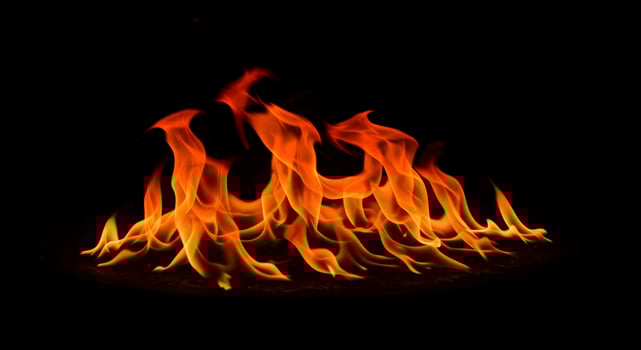 Captivating flames dancing against a dark backdrop, fire element concept photo