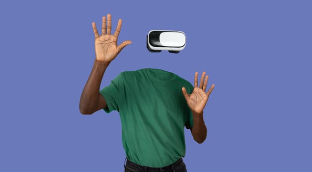 A person wearing virtual reality goggles engages with an unseen environment. Their head is not visible, creating an intriguing visual effect. Hands are raised, indicating interaction with the device. photo