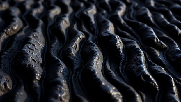 Textured Dark Surface with Flowing Patterns photo