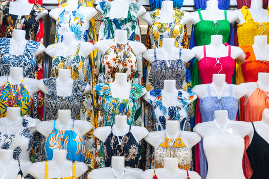 female summer dresses on mannequins on market bazaar in Asia textile clothes shop photo