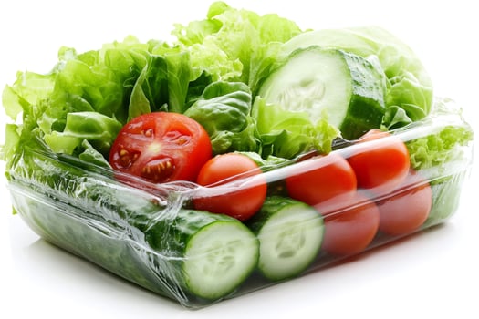 Fresh salad ingredients packed in plastic container photo