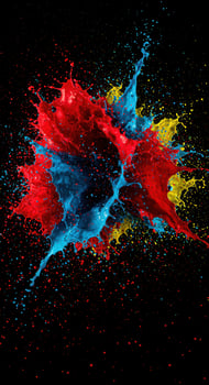 An explosion of vibrant red, blue, and yellow paint creates an energetic display. photo