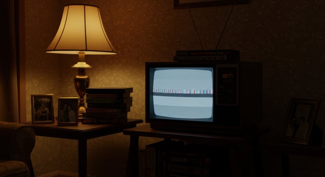 A vintage television set displays static in a dimly lit room, evoking a sense of nostalgia. photo