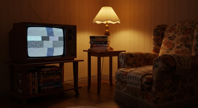 A vintage-themed living room featuring a retro television, armchair and soft lighting. photo