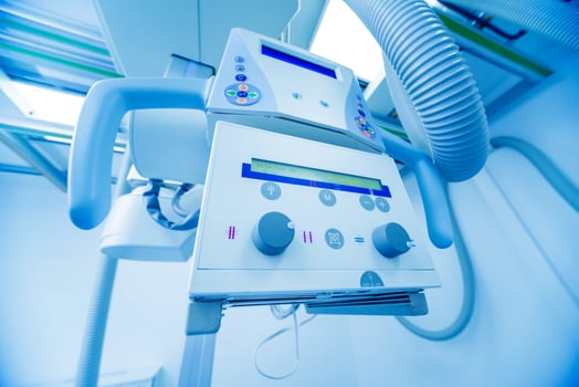 X-ray room in a hospital. Classic ceiling-mounted x-ray system. photo