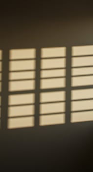 Abstract light and shadow play from a window with multiple divisions photo
