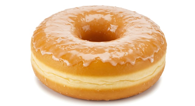 Delicious Glazed Donut Isolated on White Background Close Up View photo