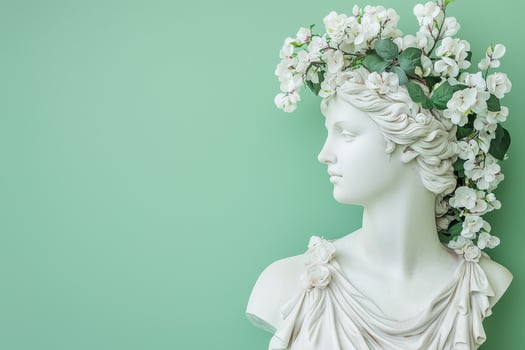 statue of a Greek goddess in a wreath of white flowers on a light green background, spring concept photo