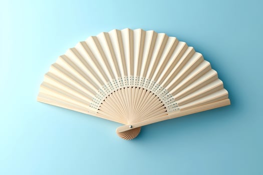 Open fan with wooden base on light blue background. Generated by artificial intelligence photo