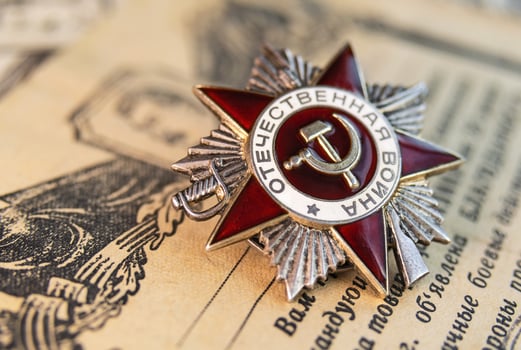 Order of the Patriotic War inscription Patriotic war against the background of award sheets photo