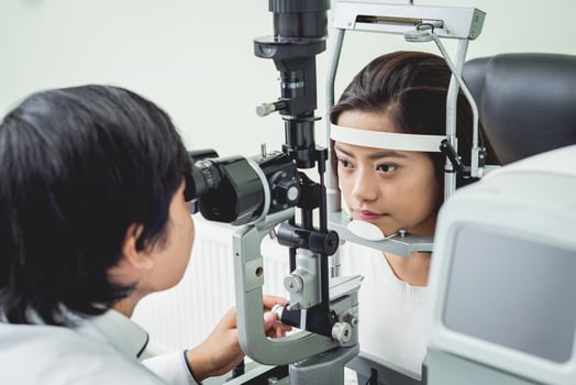Consultation with an ophthalmologist. Young asian woman and doctor photo